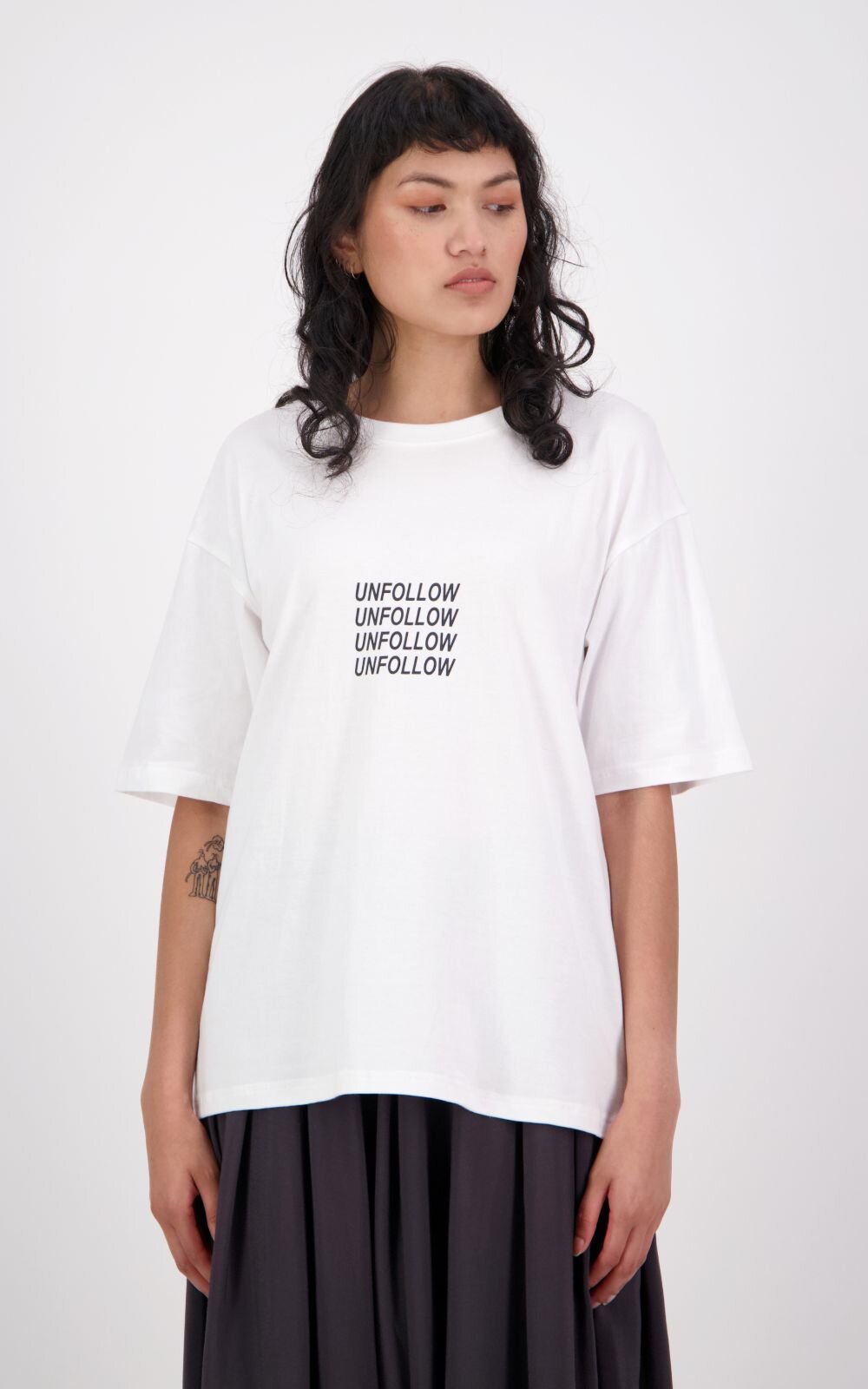 Reiji Unfollow Tee product photo.