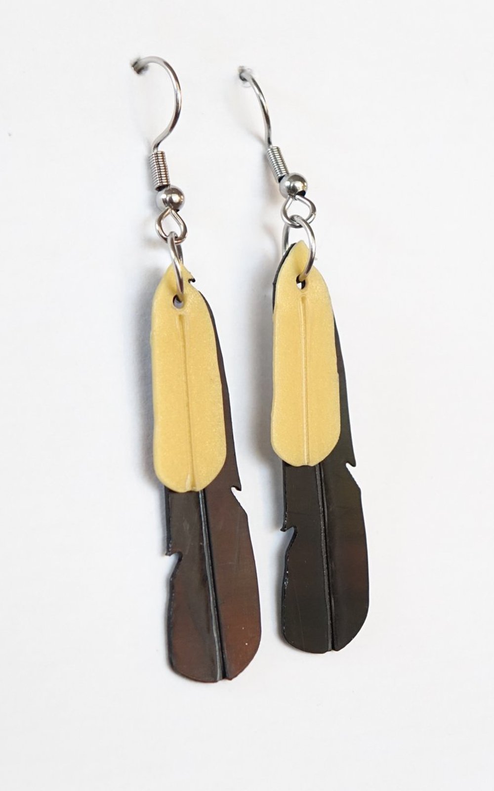 Saddleback Tieke Feather Earrings product photo.